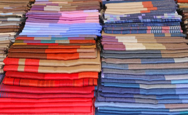 Many fabrics for sale in Italian shop — Stock Photo, Image