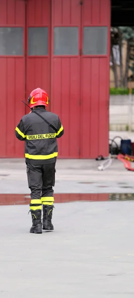 Firefighters in uniform in the firehouse — Stock Photo, Image