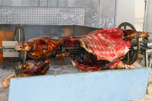 Rotisserie with a bull spit during the Festival — Stock Photo, Image