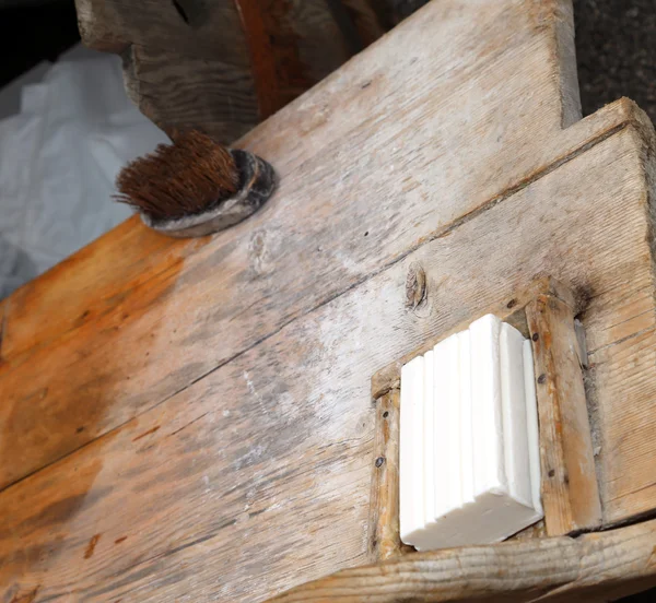 Wooden plank of an ancient washhouse with SOAP — Stock Photo, Image