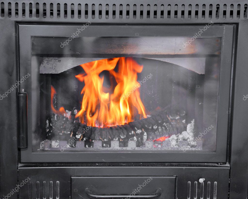 Modern woodburning stove to heat House Stock Photo by ©ChiccoDodiFC