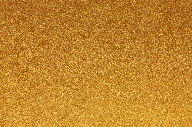 Zenginlik ve lüks zenginlik için zemin olarak kullanılabilecek koyu sarı altın rengin parıldayan arkaplanı