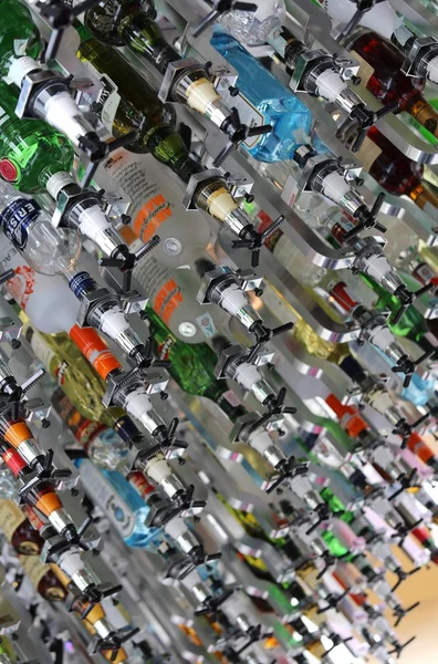 Vending machines bottles of spirits in a futuristic bar — Stock Photo, Image