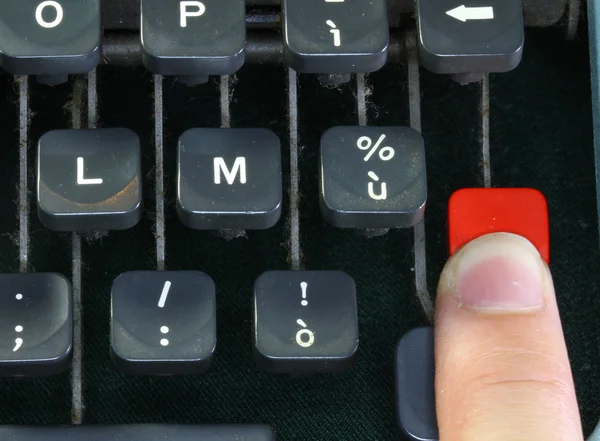 Keyboard of the old typewriter with a finger — Stock Photo, Image