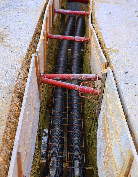 polyethylene pipes in the excavation of the road construction si