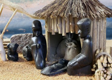 african nativity scene with baby jesus and family in a hut on Ch clipart