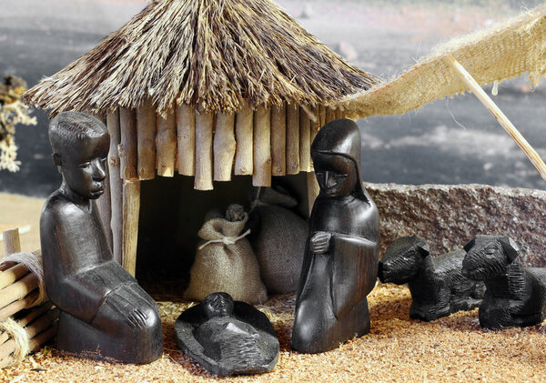 african nativity scene with baby jesus joseph and mary in a hut