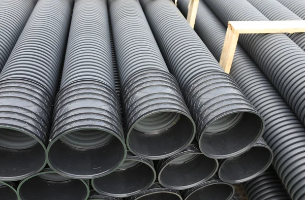 Warehouse of the corrugated pipes of plastic for laying an optic — Stock Photo, Image