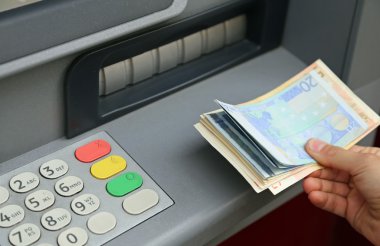 withdrawal of money in European banknotes from automatic cash ma