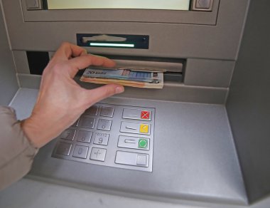 withdrawal of money in European banknotes from automatic cash ma