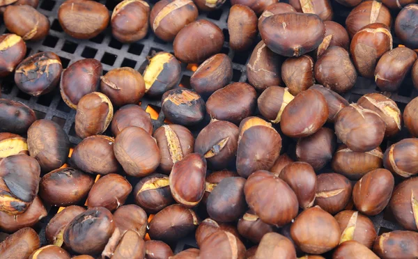 Chestnuts roasted on the fire from a street vendor on the road — Stock Photo, Image
