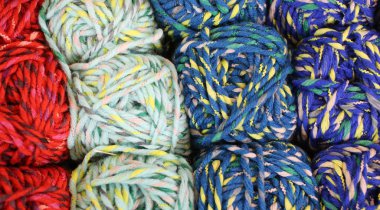 many soft balls of colored wool