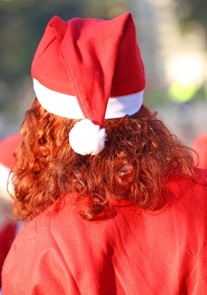 Włosy długie czerwone z Czerwonym Kapturku i strój Świętego Mikołaja — Zdjęcie stockowe