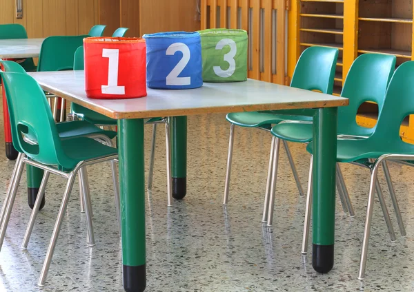 Cans with large numbers in kindergarten — Stock Photo, Image