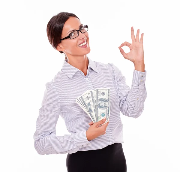 Businesswoman showing money and OK sign — Stock Photo, Image
