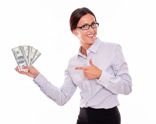 Femme impressionnée tenant des billets de dollar — Photo
