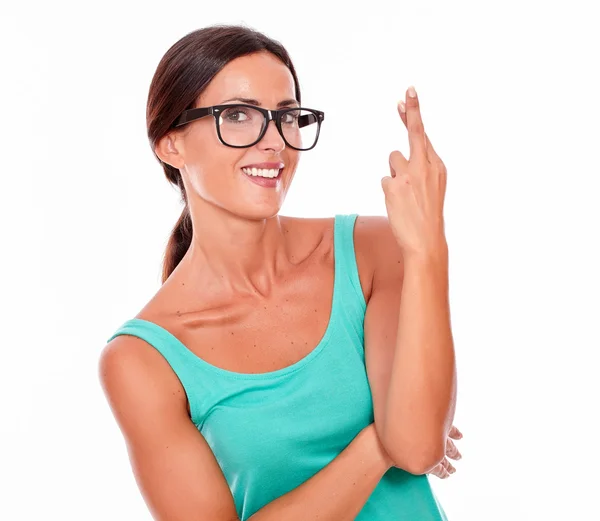 Young woman with fingers crossed — Stock Photo, Image