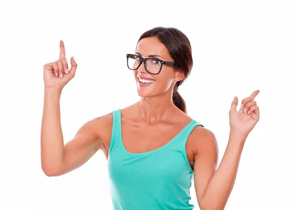 Young woman pointing upward — Stock Photo, Image