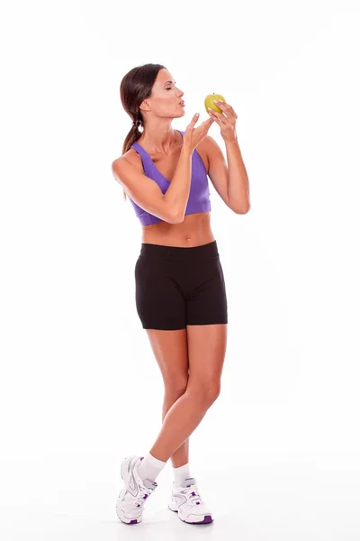 Jovem mulher apto segurando uma maçã — Fotografia de Stock