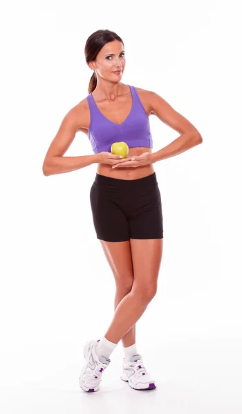 Young fit woman holding an apple — Stock Photo, Image