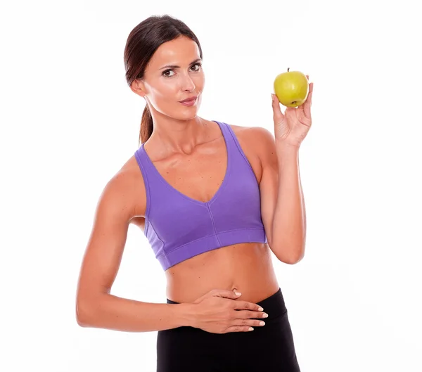 Slečno fit drží jablko — Stock fotografie