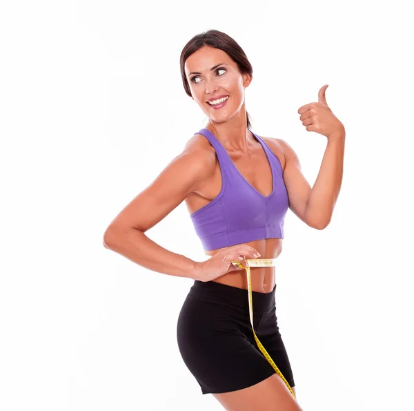 Mulher medindo sua cintura com fita — Fotografia de Stock
