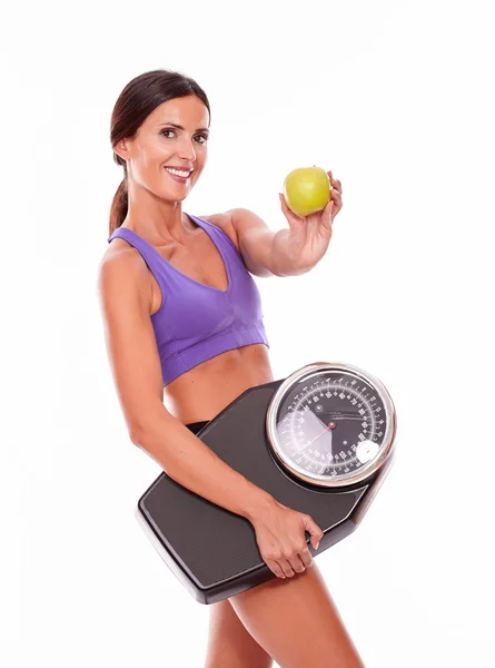 Healthy woman with apple and scales — Stock Photo, Image