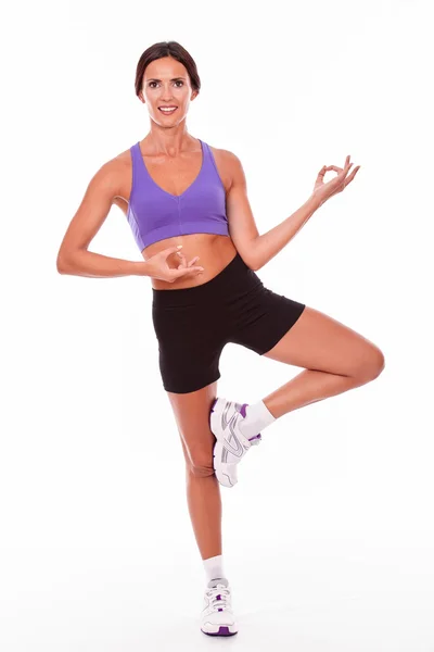 Healthy woman on one leg posing — Stock Photo, Image