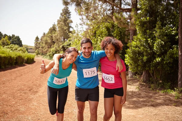 Three runners celebrating race end — Stock Photo, Image