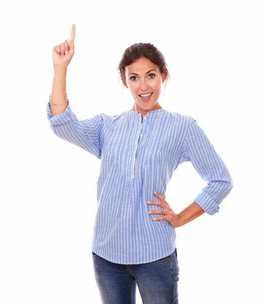 Hispanic lady pointing up while standing — Stock Photo, Image