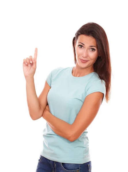 Adult lady pointing up and looking at you — Stock Photo, Image