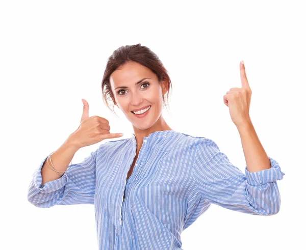 Charming adult lady with call gesture pointing up — Stock Photo, Image
