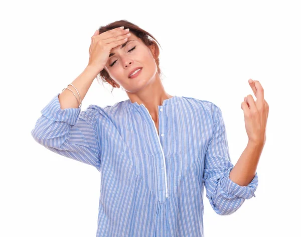 Young hispanic woman crossing her fingers — Stock Photo, Image