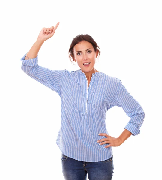 Single young woman pointing up her right arm — Stock Photo, Image