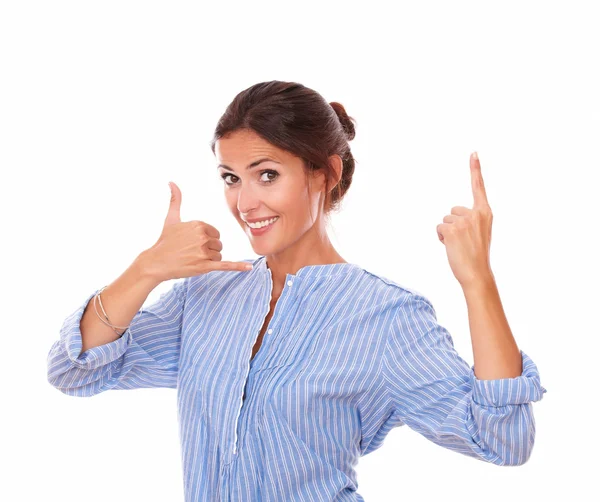 Friendly latin lady with call gesture pointing up — Stock Photo, Image