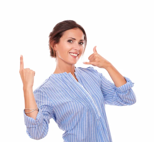 Hispanic woman with call gesture pointing up — Stock Photo, Image