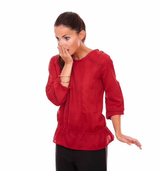 Surprised young woman closing her mouth — Stock Photo, Image