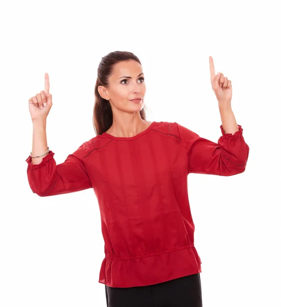 Charming latin female pointing up her fingers — Stock Photo, Image