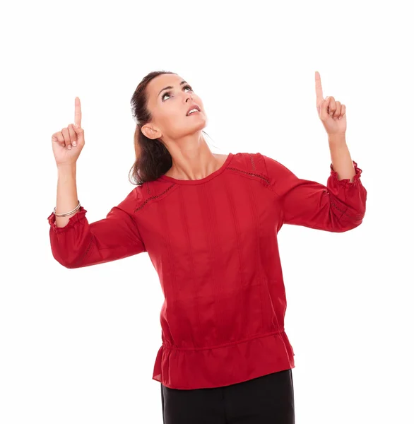 Friendly young woman pointing up her fingers — Stock Photo, Image