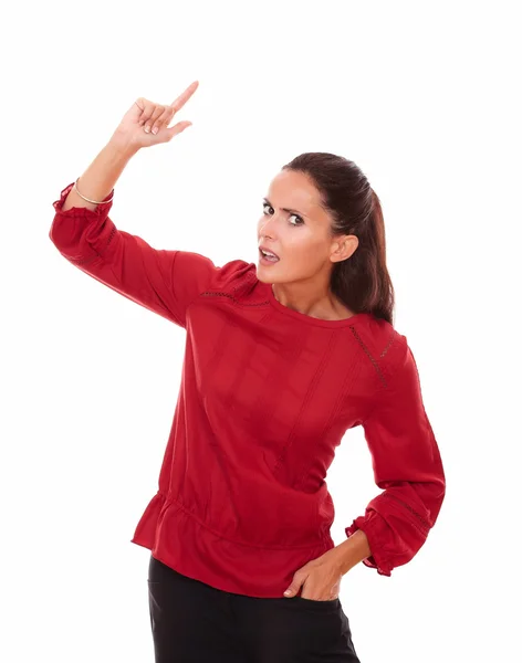 Surprised lovely woman pointing up while standing — Stock Photo, Image