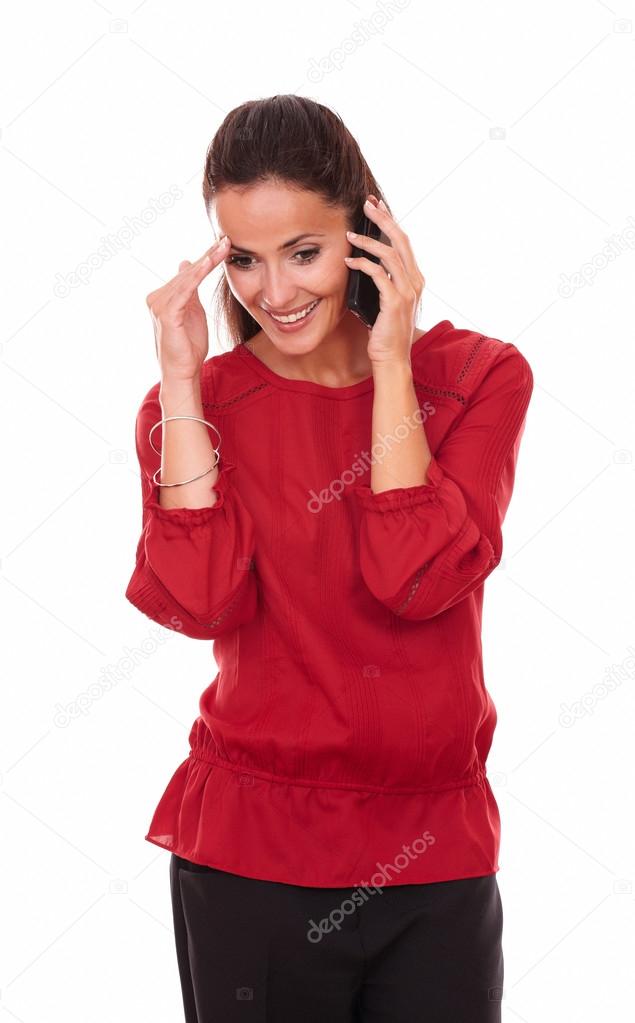Happy latin lady talking on her phone