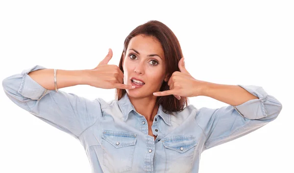 Friendly adult brunette with phone gesture — Stock Photo, Image