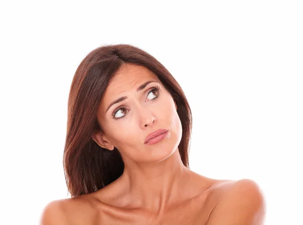 Unhappy adult female looking up to her left — Stock Photo, Image