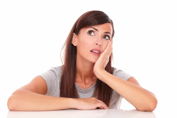 Reflective woman wondering while looking up — Stock Photo, Image