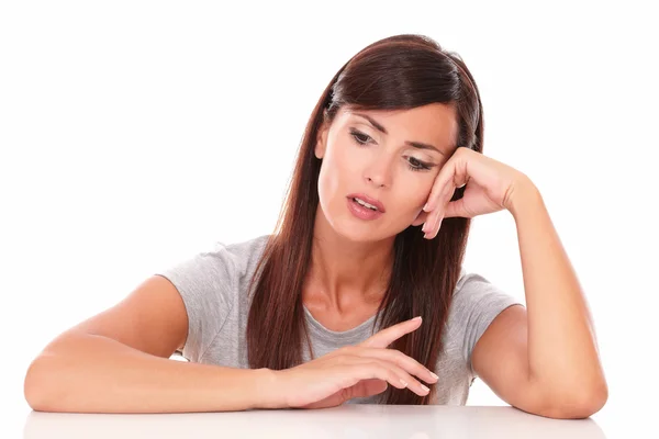 Friendly latin female wondering while looking down — Stock Photo, Image