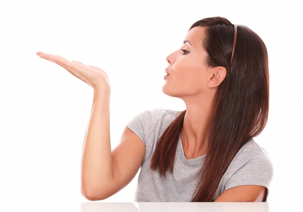 Friendly female blowing to her right — Stock Photo, Image