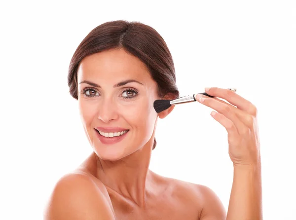 Beautiful female applying facial care product — Stock Photo, Image