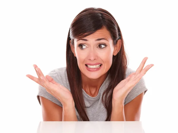 Surprised latin woman with errors hands — Stock Photo, Image