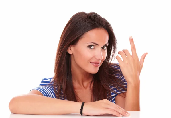 Charming lady with finger pointing up — Stock Photo, Image