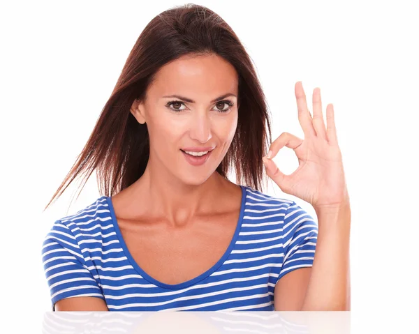 Smiling young lady gesturing ok sign — Stock Photo, Image
